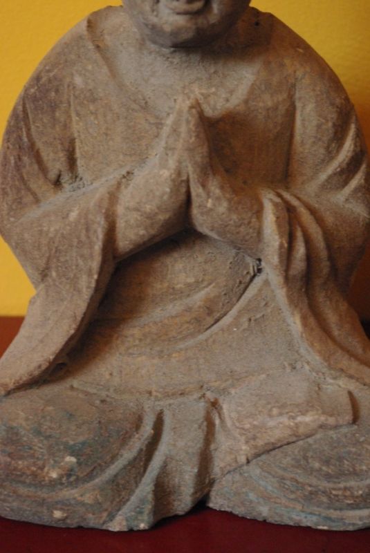 Statue of a Buddhist monk in prayer position 3