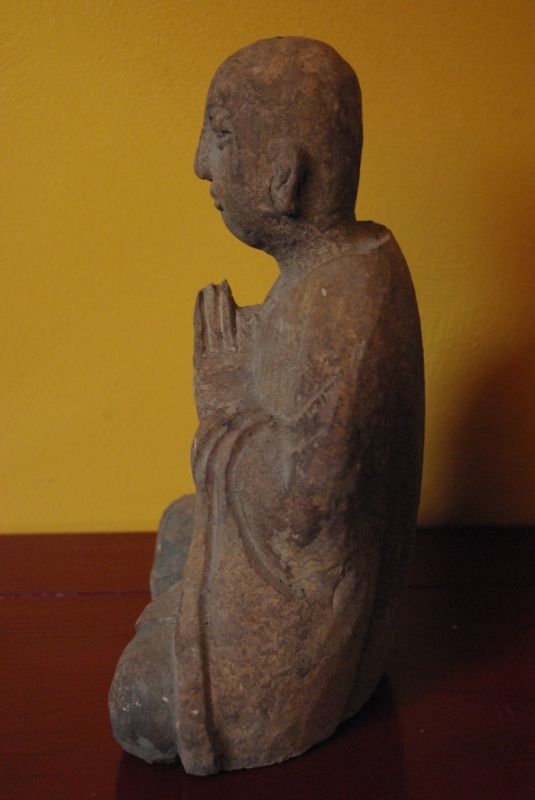 Statue of a Buddhist monk in prayer position 4