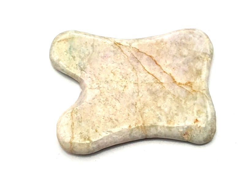Traditional Chinese medicine - Gua Sha concave in Jade - light green with yellow/brown reflections 1